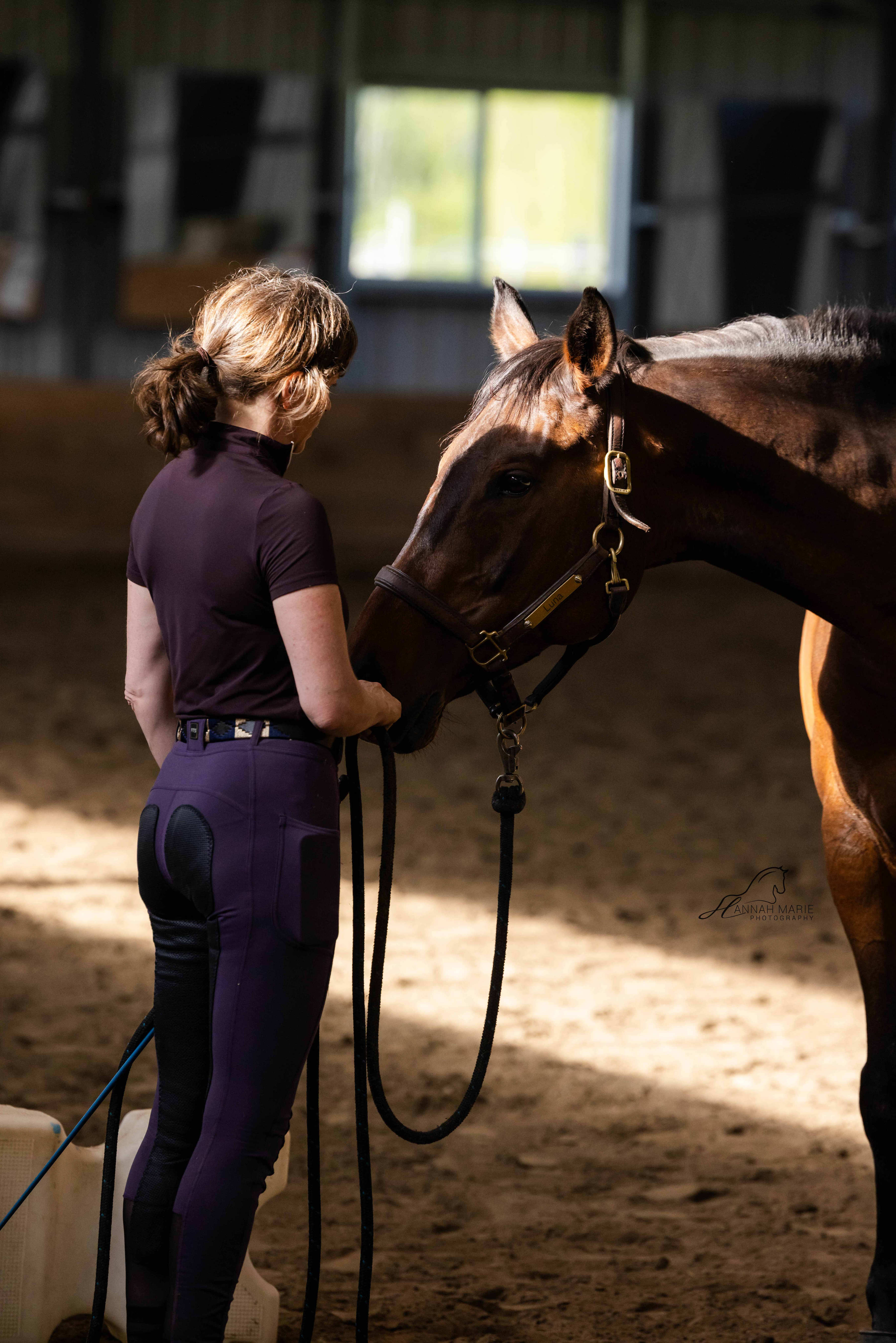 A quiet moment of connection between a child and her horse